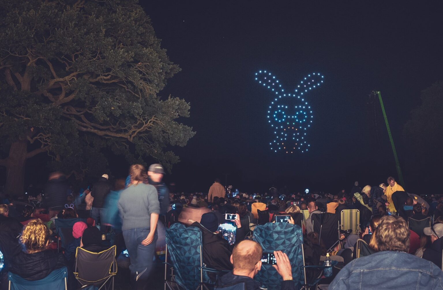 A DroneSwarm audience watching an animated drone character at Newby Hall