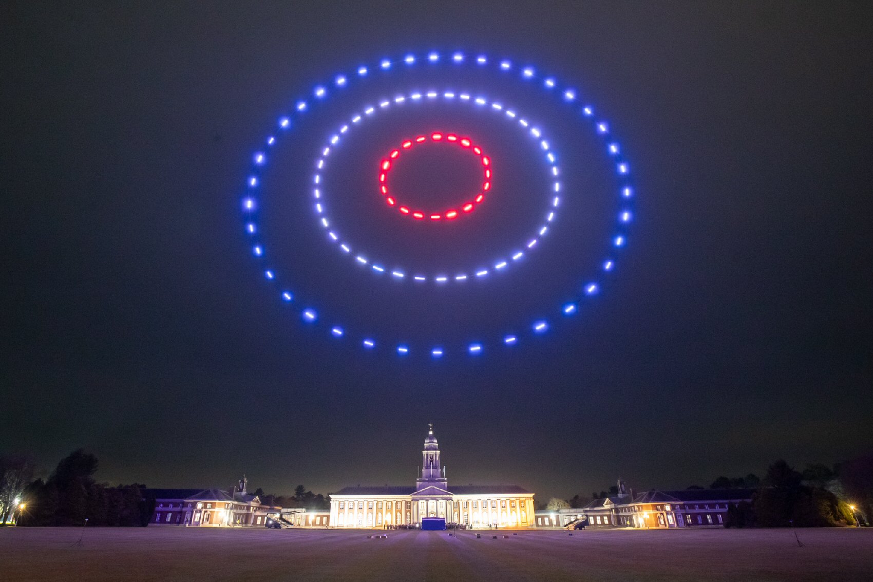 Circular drone formation above a corporate venue