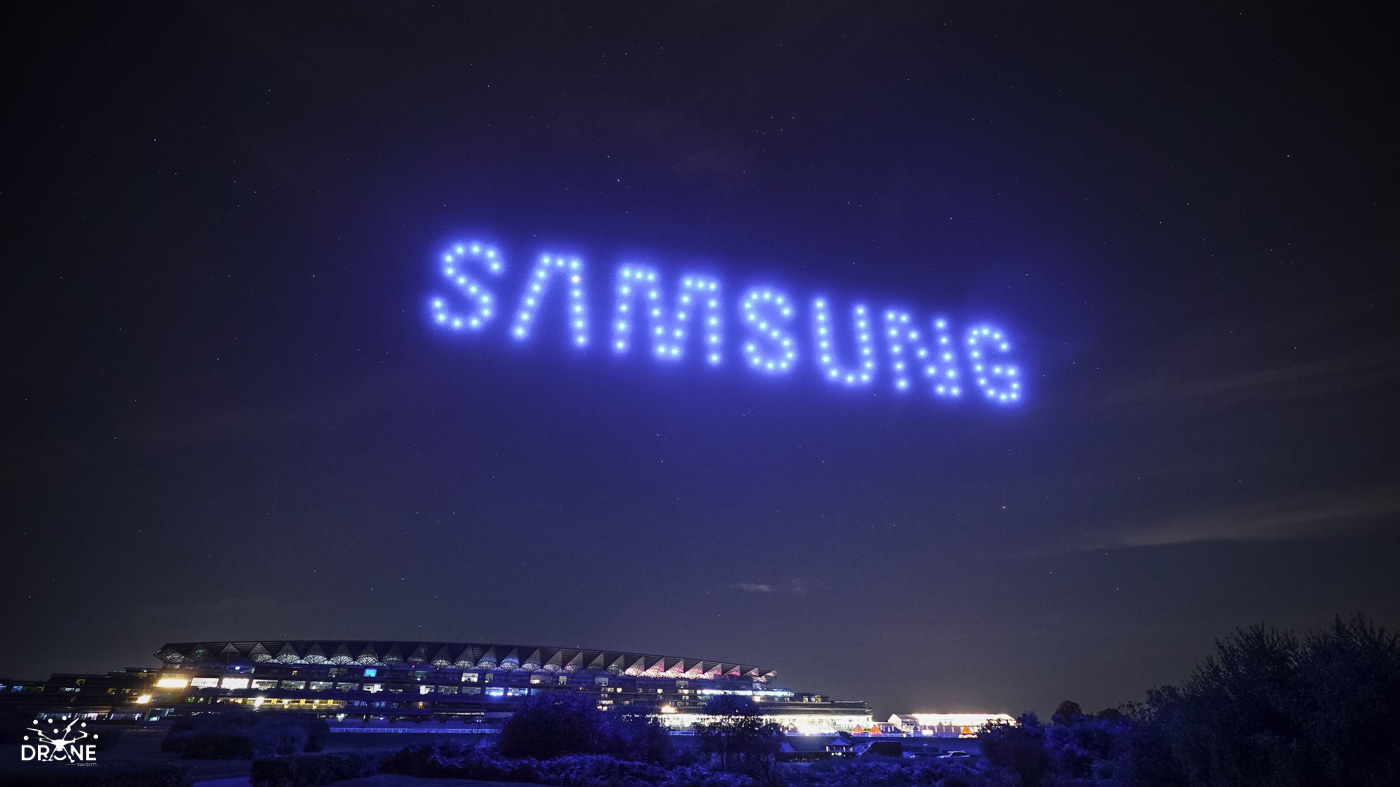 LG logo formed by drones above a large venue
